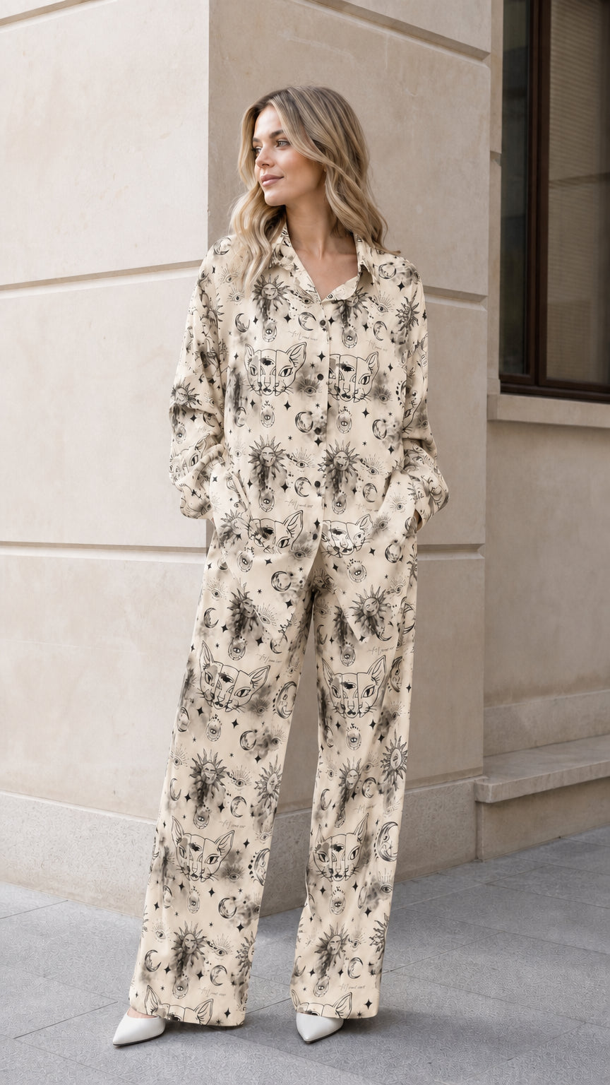 Woman wearing beige celestial sun and moon print pajama set
