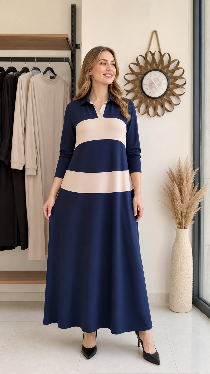Front full-length view of woman wearing navy blue and beige colorblock polo maxi dress