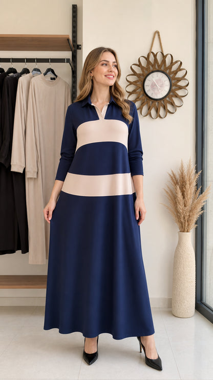 Front full-length view of woman wearing navy blue and beige colorblock polo maxi dress