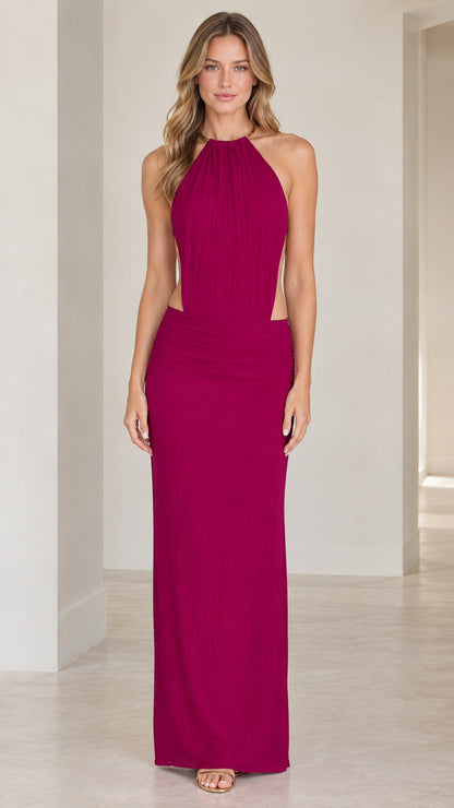 Front full-length view of model wearing the magenta halter neck cutout maxi dress