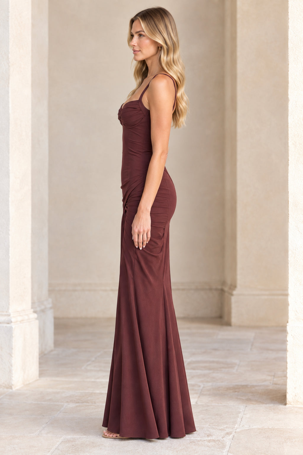 Side profile of model wearing Chocolate Brown floor-length evening gown