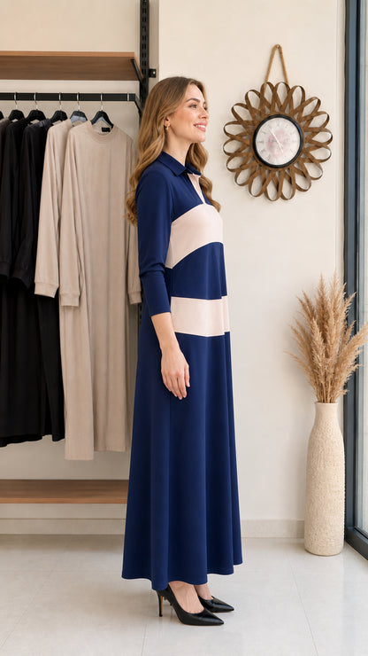 Side profile view of woman wearing navy blue long sleeve polo maxi dress