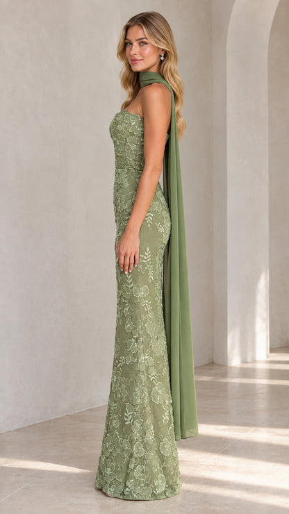 Side view of sage green embroidered column gown showing trailing chiffon scarf