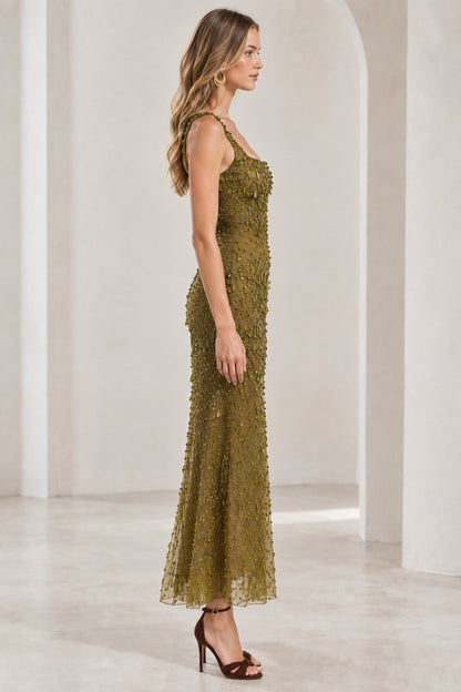 Side profile view of olive green embellished sleeveless formal gown