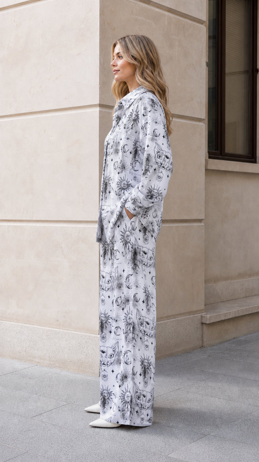 Side profile view of woman wearing white celestial graphic loungewear set