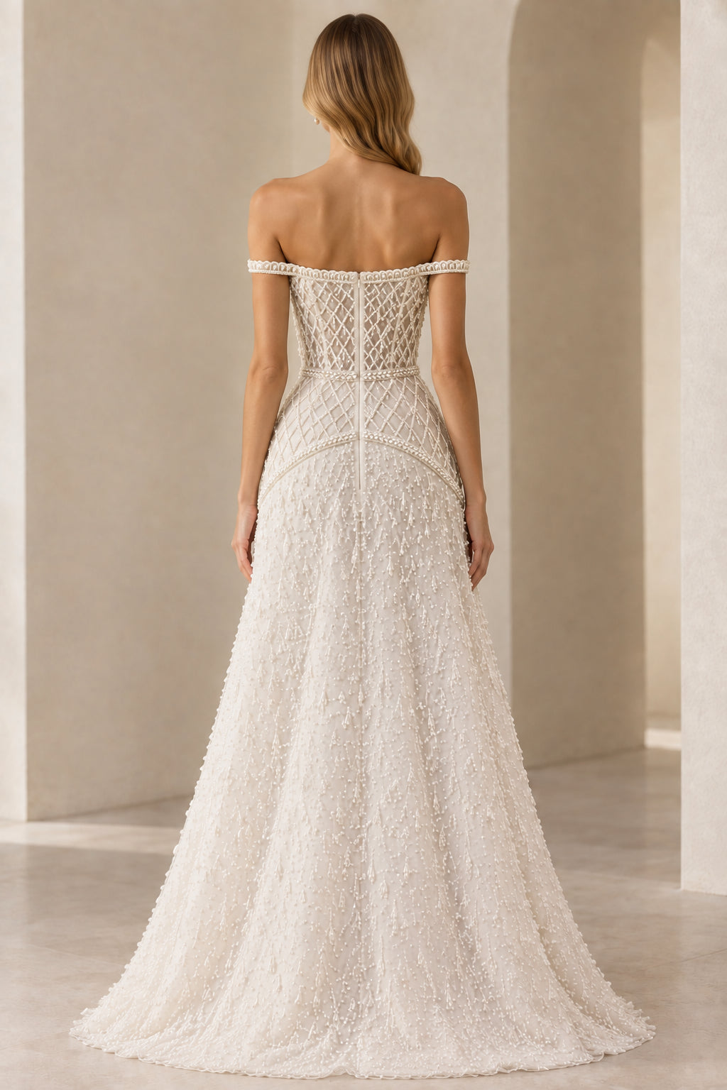 Back view of ivory beaded formal gown showing off-shoulder cut and structured back