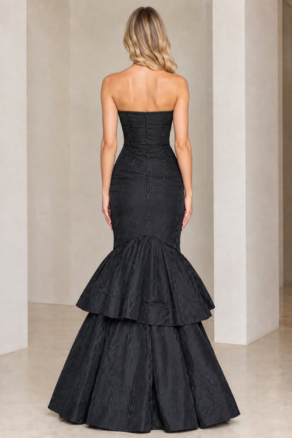 Back view of black strapless evening gown showing zipper closure