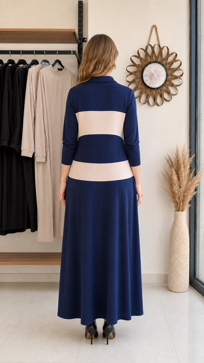 Back view of woman wearing navy blue polo maxi dress with beige stripes