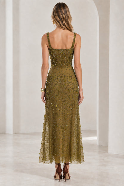 Back view of model in olive green beaded maxi dress with wide straps