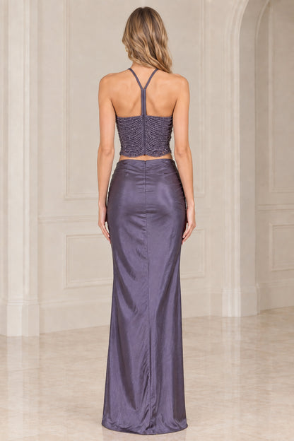 Back view of dusty purple two-piece gown showing T-back beaded halter and sleek satin skirt