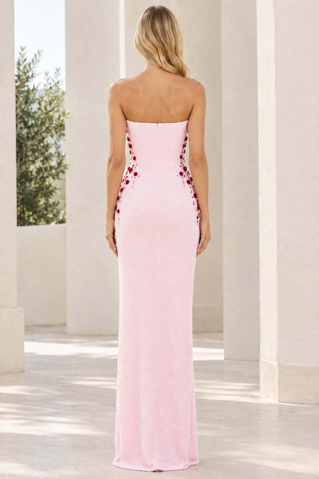 Back view of model in Blush Pink strapless floor-length column dress with back zipper
