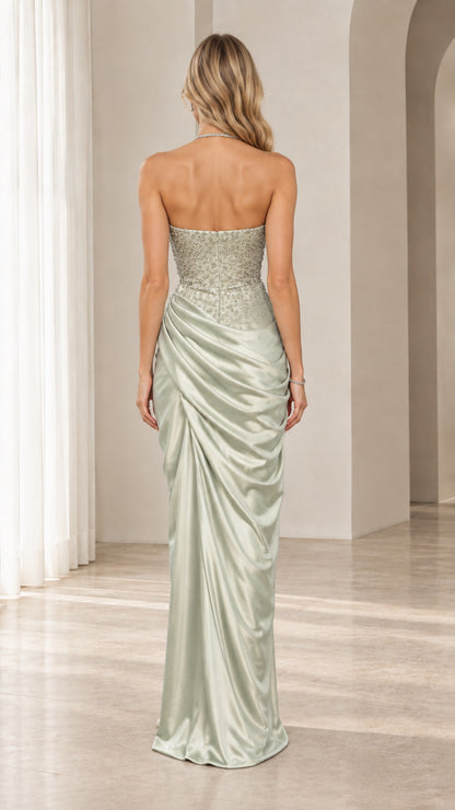 Back view of model wearing sage green satin floor-length formal gown