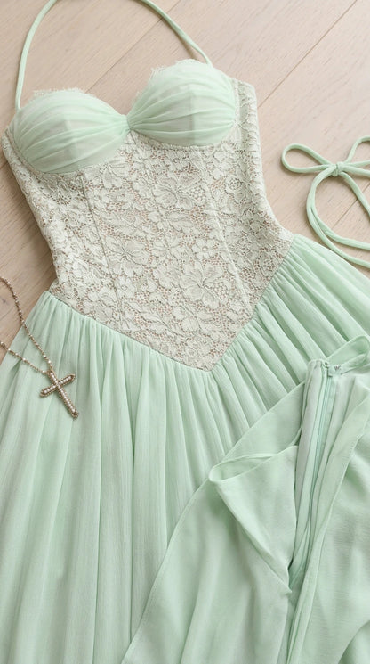 Close-up detail of mint green sweetheart ruched bust and floral lace bodice