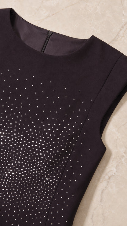 Close up detail of round neckline, cap sleeves, and sparkling rhinestone bodice