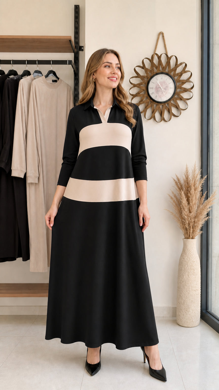 Woman wearing black and beige colorblock long sleeve polo maxi dress