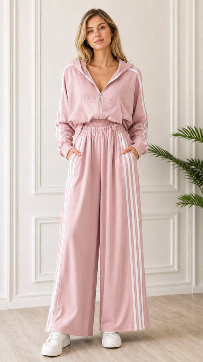 Full-length front view of woman wearing Blush Pink 2-piece striped tracksuit set