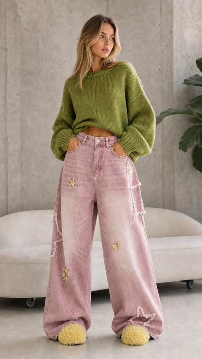 Full front view of dusty pink vintage wash celestial star wide leg denim pants