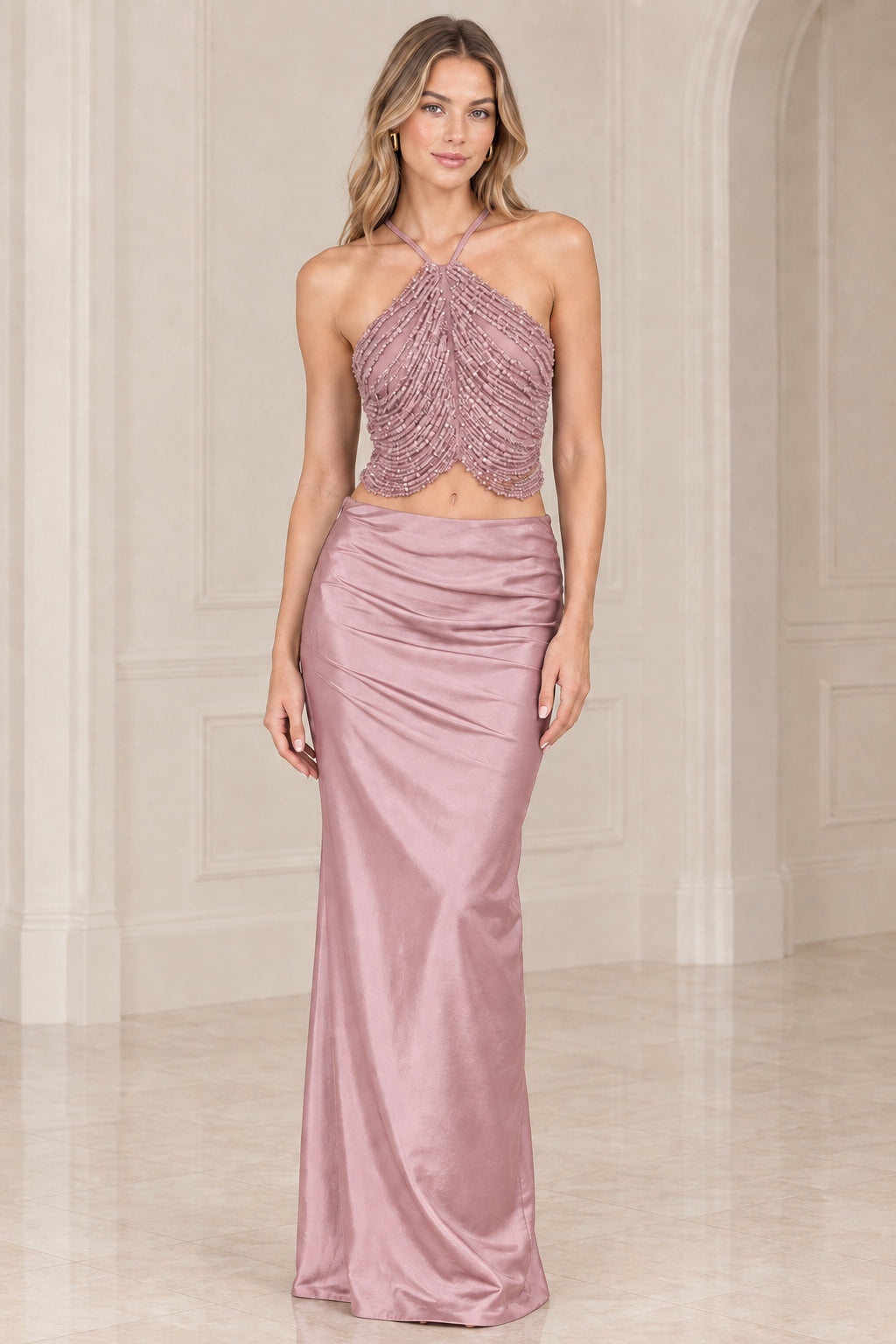 Dusty rose two-piece formal dress with beaded halter crop top and satin maxi skirt