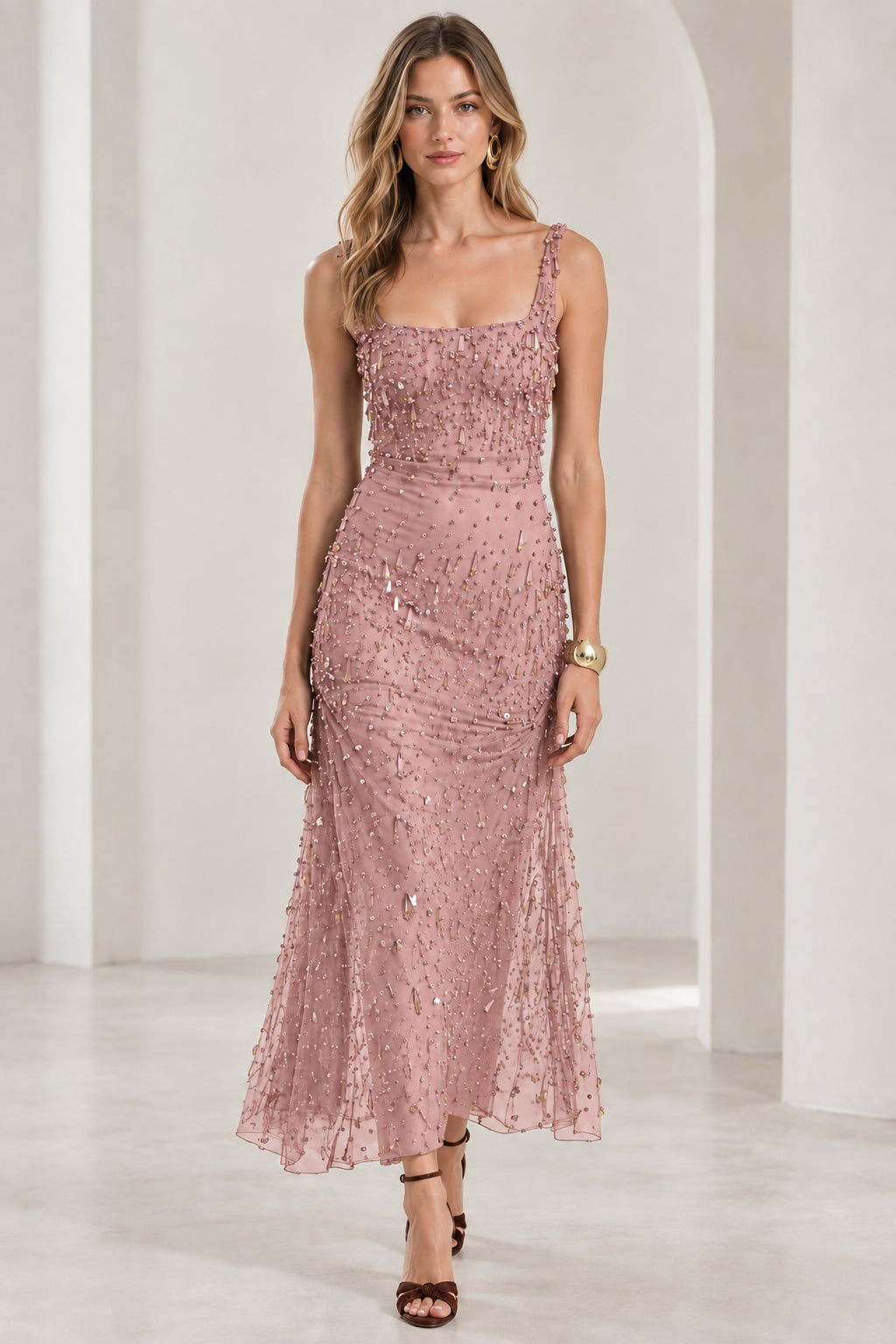 Front view of model wearing dusty pink beaded sleeveless formal dress