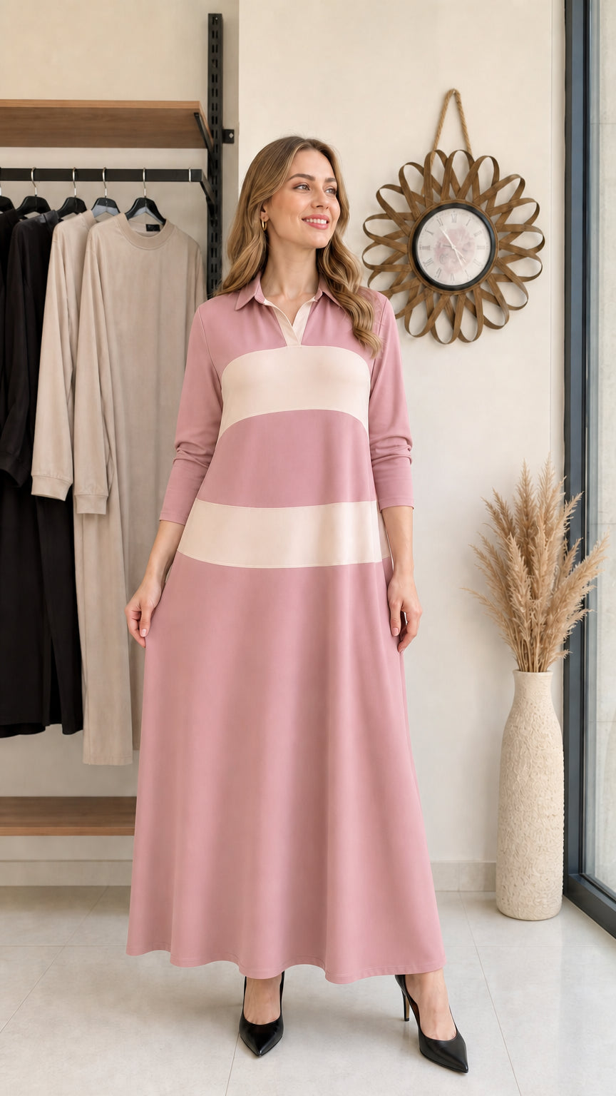 Woman wearing dusty rose and cream colorblock long sleeve polo maxi dress