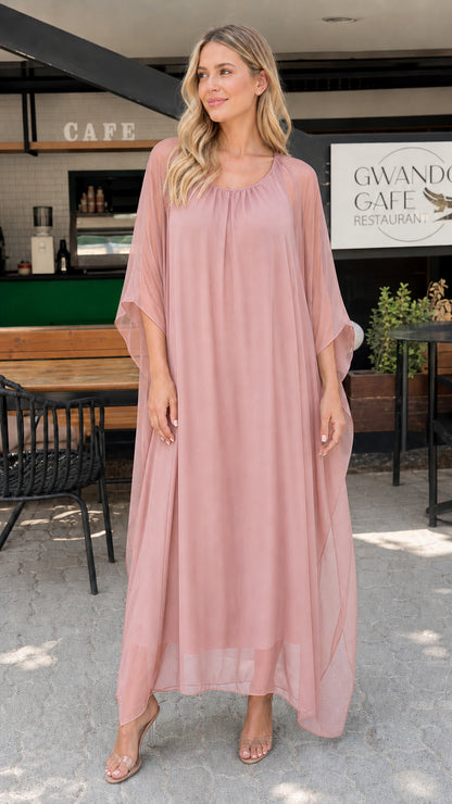 Model wearing dusty rose pink chiffon kaftan maxi dress