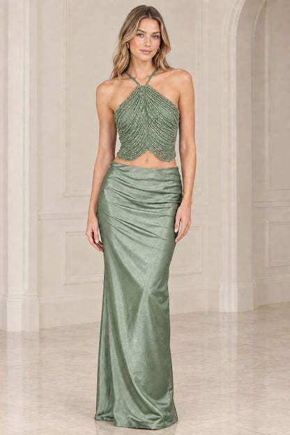 Sage green two-piece evening gown with embellished halter top and long satin skirt