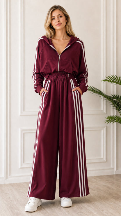 Full-length front view of woman wearing Burgundy 2-piece striped tracksuit set