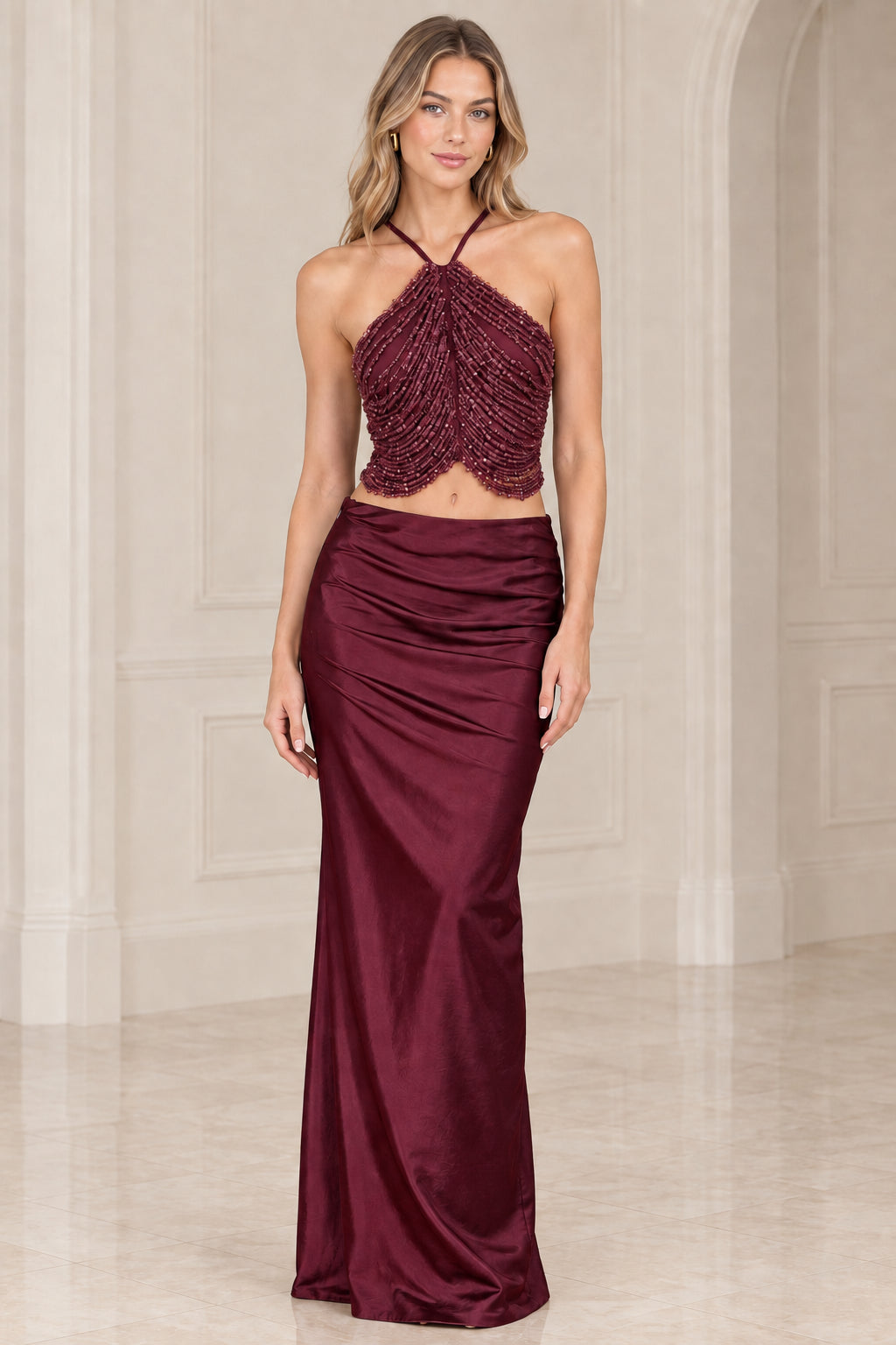 Burgundy wine two-piece formal set featuring beaded halter bodice and satin maxi skirt