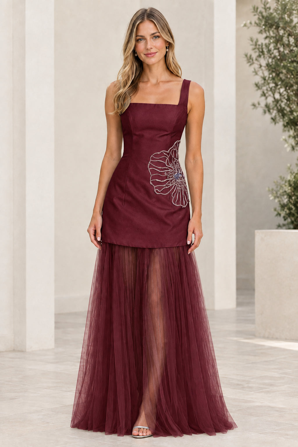Front view of burgundy red formal evening gown with sheer tulle skirt