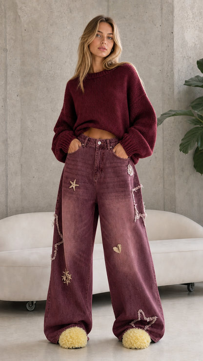 Full front view of washed burgundy star embroidered wide leg baggy jeans