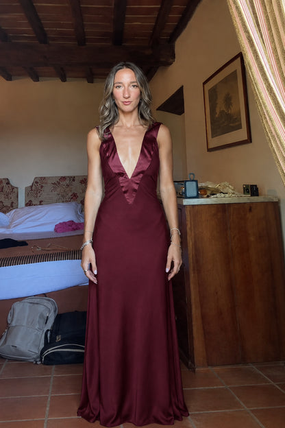 Front view of burgundy wine deep V-neck satin maxi dress
