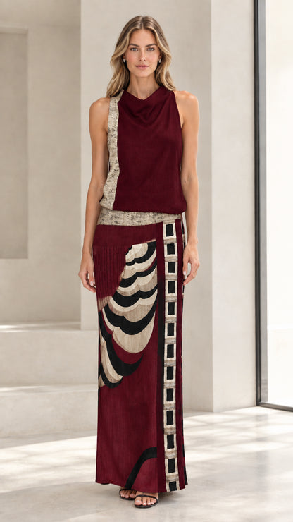 Front full-length view of model wearing burgundy red sleeveless cowl neck abstract maxi dress