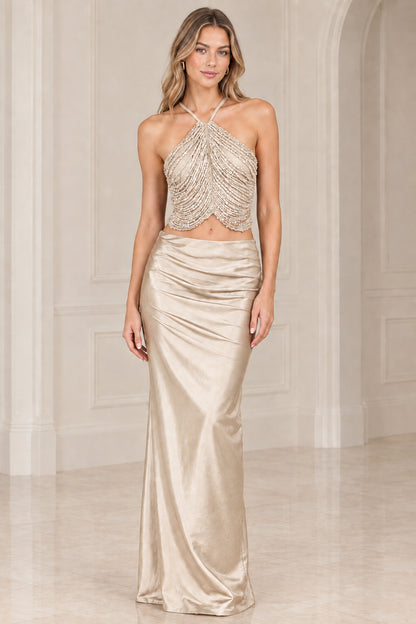 Champagne gold two-piece evening gown with beaded halter top and satin skirt