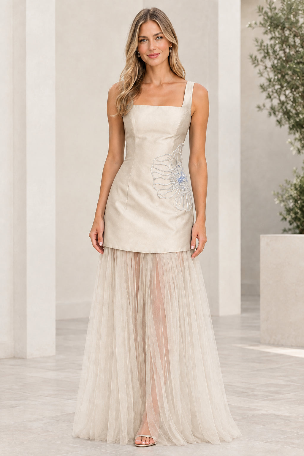 Front view of champagne ivory square neck evening gown with sheer tulle skirt
