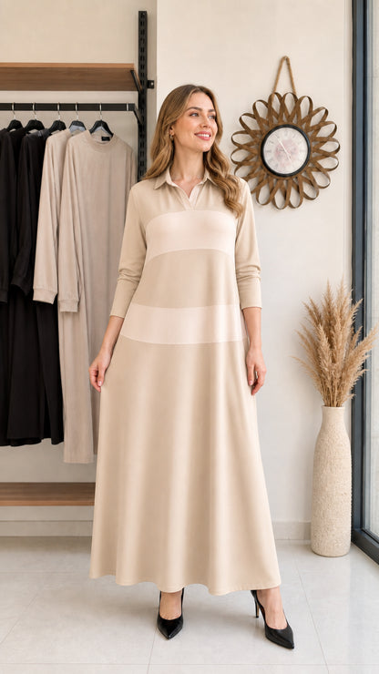 Woman wearing beige and light cream colorblock long sleeve polo maxi dress